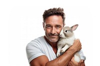 Spainish middle age man hugging rabbit portrait mammal animal. AI generated Image by rawpixel.