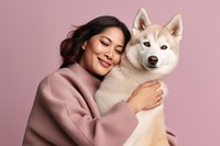 Thai middle age woman hugging siberian husky pet looking animal. AI generated Image by rawpixel.