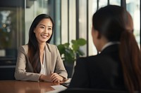 Filipino businesswoman conversation interview office. AI generated Image by rawpixel.