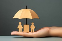 Hand holding umbrella wood finger togetherness protection. AI generated Image by rawpixel.
