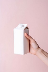 Milk box holding hand letterbox. AI generated Image by rawpixel.