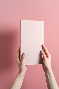 Book book publication holding. AI generated Image by rawpixel.