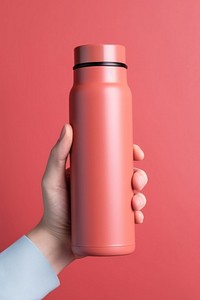 Thermal flask holding bottle hand. AI generated Image by rawpixel.