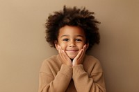 Black kid in sweater smiling portrait smile happy. AI generated Image by rawpixel.