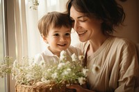 Sweet family of happy mother and little son holding wicker basket photography portrait flower. 