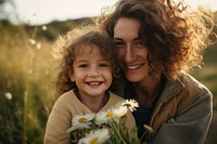 Sweet family portrait of happy mother and little son holding wicker basket photography outdoors flower. 