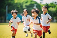 Diverse school kids playing soccer football outdoors sports. 