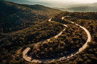 Winding mountain road outdoors nature forest. AI generated Image by rawpixel.