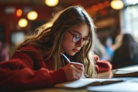 Girl student taking exam glasses writing school. AI generated Image by rawpixel.