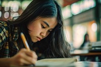 Girl student taking exam writing pen concentration. AI generated Image by rawpixel.