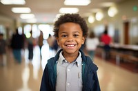 Latinix elementary school student smiles portrait photo architecture. AI generated Image by rawpixel.