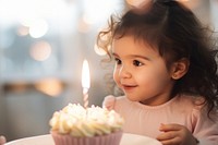Little Latina baby girl candle cake birthday. AI generated Image by rawpixel.