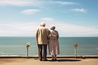 Old married couple sea standing outdoors. AI generated Image by rawpixel.