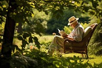 Elderly man enjoying a book in a serene garden setting surrounded by lush greenery reading relaxation sunlight. AI generated Image by rawpixel.