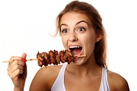 Girl eating biting kebab. AI generated Image by rawpixel.
