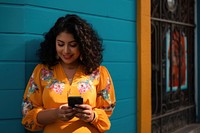 Homely chubby latina texting smartphone adult architecture portability. AI generated Image by rawpixel.