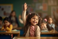 Little chubby latina student raise her hand classroom school child