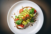 Avocado toast plate tomato food. 