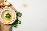 Hummus table plant herbs. AI generated Image by rawpixel.