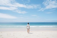 A person standing on a beach outdoors horizon nature. AI generated Image by rawpixel.