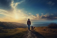 Boy walking his dog on hills photography adventure outdoors. AI generated Image by rawpixel.