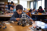 African student child plays constructing robot adult concentration technology. AI generated Image by rawpixel.