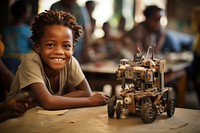 African student child plays constructing robot smile technology happiness. 