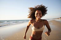 Blackgirl running to sea turn head back smile swimwear outdoors nature. AI generated Image by rawpixel.