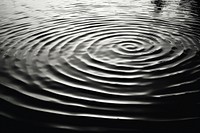 Ripples on water surface outdoors nature black. AI generated Image by rawpixel.