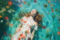 Woman lay down underwater portrait outdoors nature. 