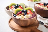 Acai bowl breakfast spoon table. AI generated Image by rawpixel.