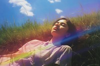 Girl sleep comfortably on meadow sunlight portrait outdoors. AI generated Image by rawpixel.