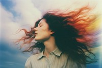 A close up of a person with their eyes closed adult blue sky. AI generated Image by rawpixel.