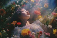 A girl sleep comfortably on bloom meadow portrait outdoors nature. AI generated Image by rawpixel.