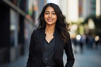 Black and mixed south asian woman standing smiling jacket. AI generated Image by rawpixel.
