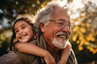 Hispanic family grandfather laughing glasses. 