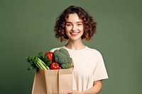 Woman hold paper bag vegetable smiling smile. AI generated Image by rawpixel.