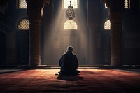 Muslim man praying inside the mosque adult contemplation spirituality. 