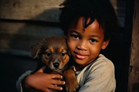 A little black kid hug a puppy dog pet photography. AI generated Image by rawpixel.