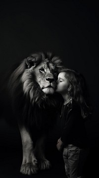 A little girl kissing lion cheek photography portrait mammal. 