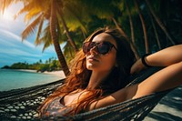 Woman sleeping in a hammock under the coconut tree on the beach sunglasses vacation day. AI generated Image by rawpixel.