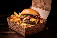 A cheese burger with chedda cheese and bacon on the wood table paper food hamburger. AI generated Image by rawpixel.