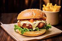 A chicken burger with chedda cheese and bacon on the wood table food restaurant hamburger. AI generated Image by rawpixel.
