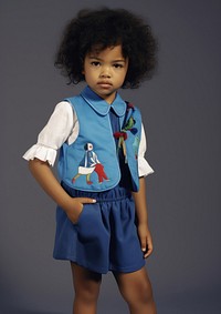 A little black girl wearing cute horse embroidery blue uniform photography portrait dress. AI generated Image by rawpixel.