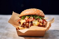A shrimp burger with chedda cheese and bacon on the wood table paper food hamburger. AI generated Image by rawpixel.