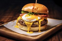 An egg burger with chedda cheese and bacon on the wood table food hamburger breakfast. AI generated Image by rawpixel.
