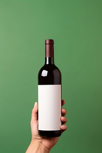 Wine bottle holding drink hand. AI generated Image by rawpixel.