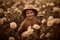 Little boy in a rose field photography portrait outdoors. 