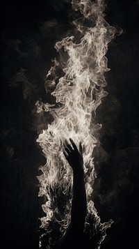 Black burning flame white smoke hand. AI generated Image by rawpixel.