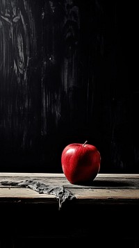 Red apple fruit black table. AI generated Image by rawpixel.